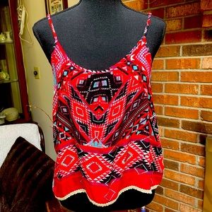 Cute red, turquoise, and black tank top with bone trim, and adjustable straps.